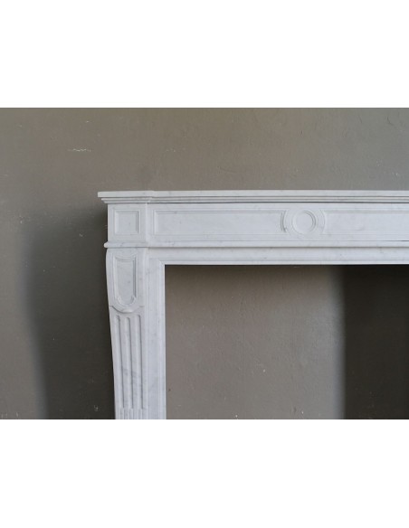 Antique neoclassical “Languette” fireplace mantel carved in top quality white Carrara marble.