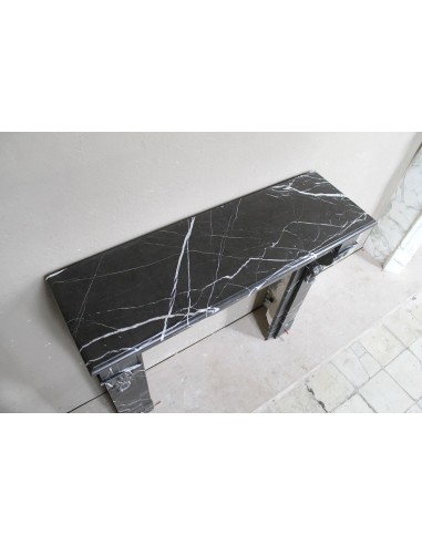 Cornice da camino antica, modello "Palmettes", scolpito in finissimo marmo Nero Marquinia.