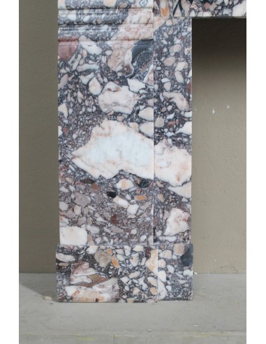 Camino antico Art Deco in marmo Africano variopinto. Questa cornice in marmo da camino è autentica e d'epoca Art Deco.